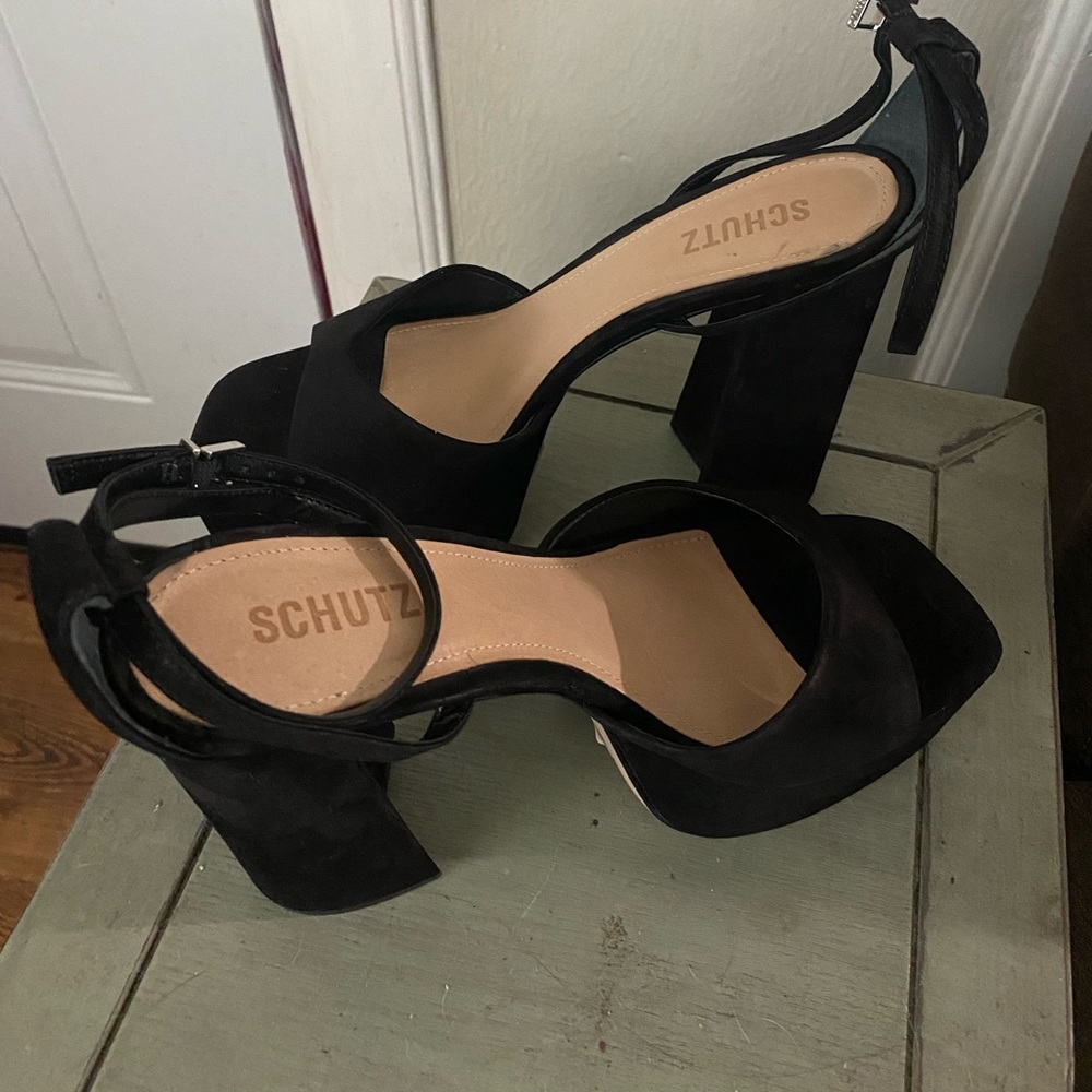 Black heels with 5.5” heel.